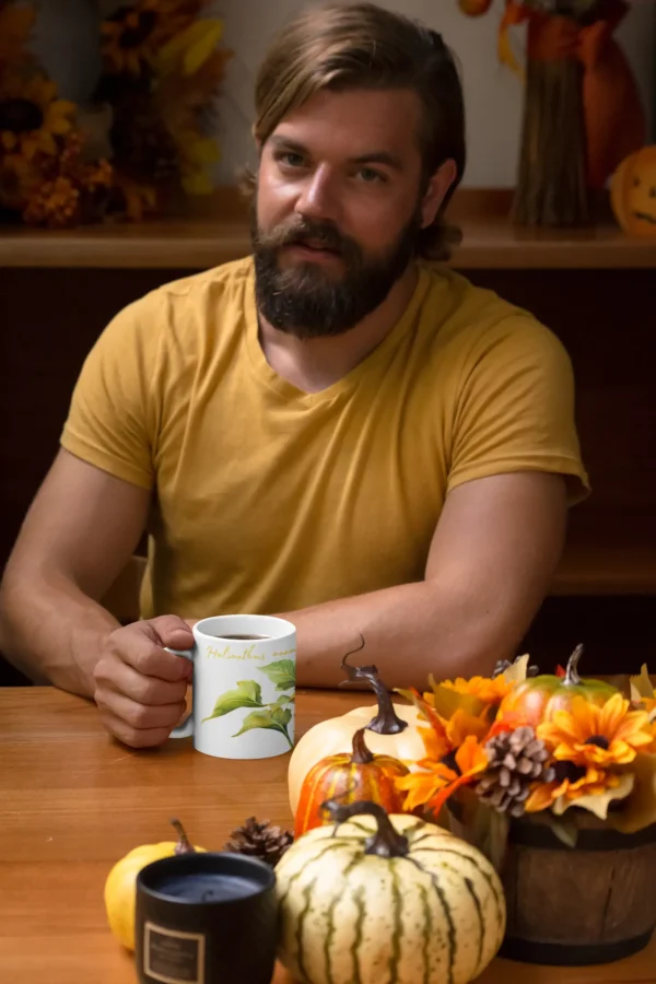 mockup of a man drinking from an 11 oz at the table 29162 1