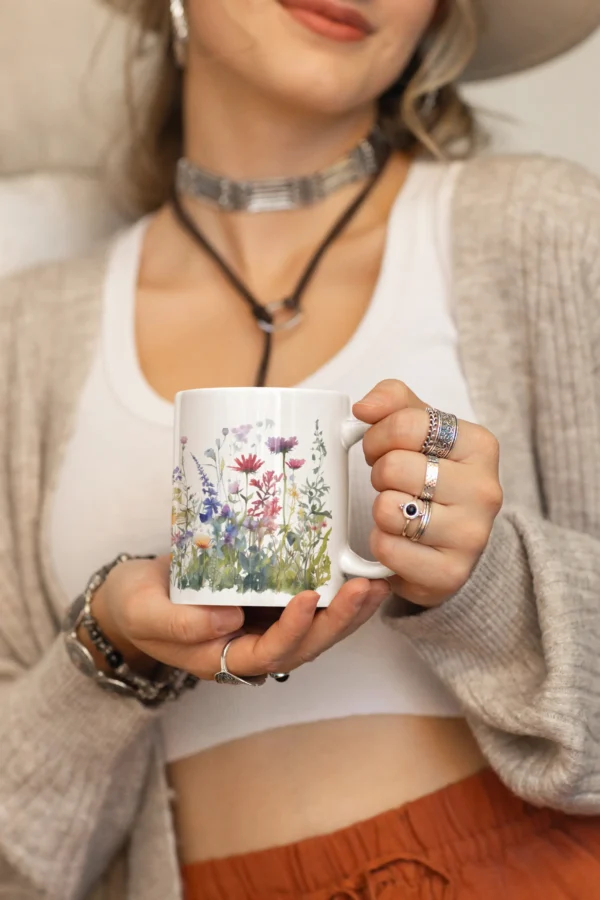 mockup of a woman in a boho outfit holding an 11 oz coffee mug m36859 scaled